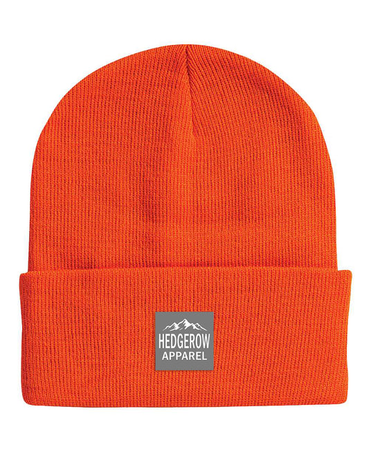 Hedgerow Apparel orange visibility hunting beanie, crafted for hunters with warm, durable fabric and a snug fit for cold weather outdoor adventures
